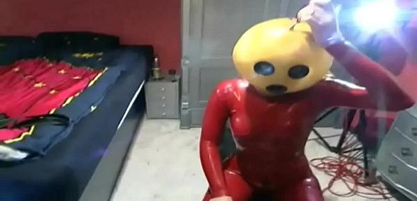  Fetish depravation for a red latex dressed slave